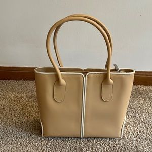 Gorgeous upscale tan leather handbag with cream piping detail